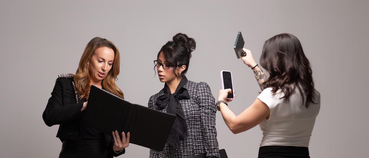 The team at work: reviewing a folder and capturing content on a phone